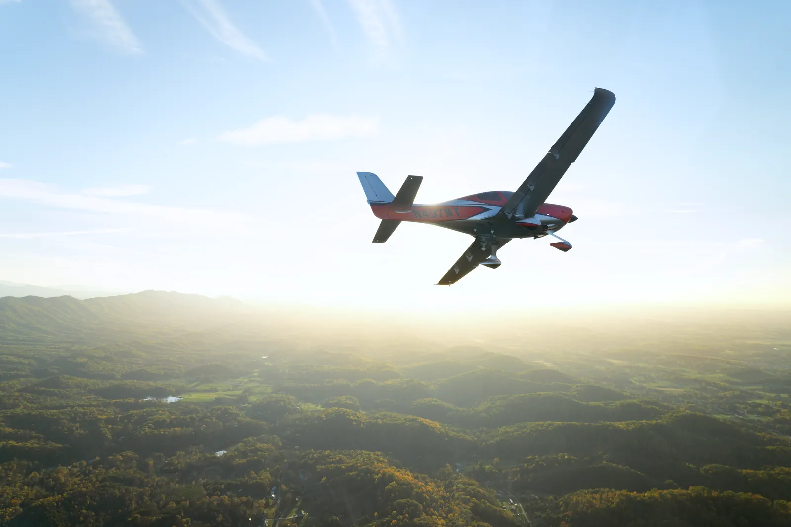 Cirrus SR22 in flight above the clouds — business travel redefined